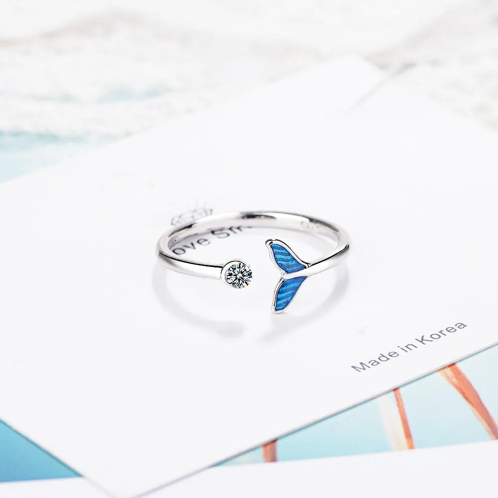 Blue mermaid tail cuff ring with cubic zirconia and epoxy accents, adjustable 17mm, white gold finish