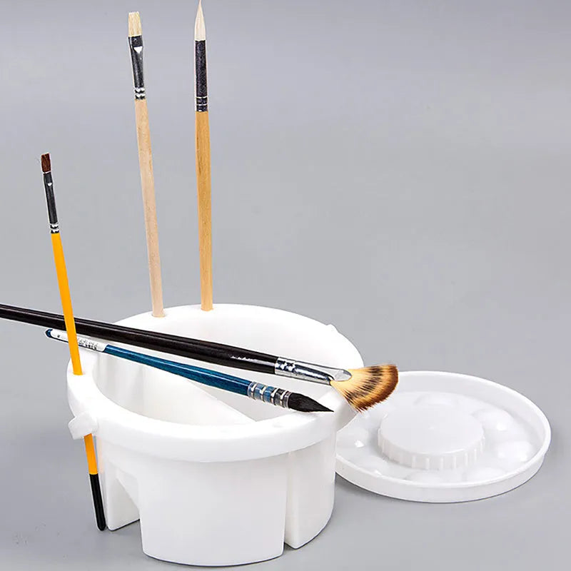White plastic portable brush holder for painting, shown with approximate 16.5 cm diameter.