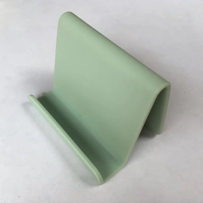 Candy colour plastic phone holder showing 6cm width and 4.5cm height dimensions