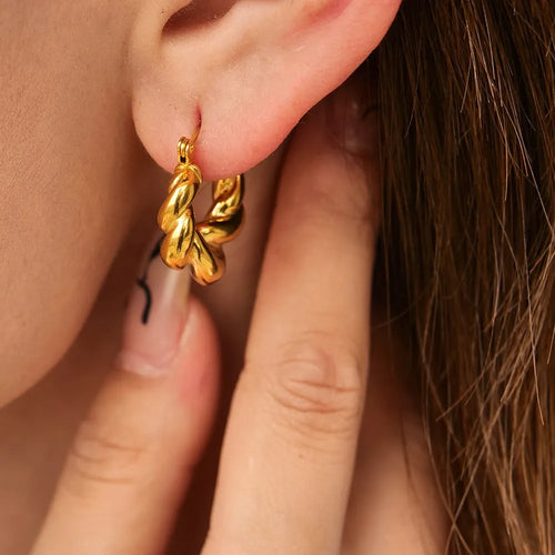 18K gold titanium steel geometric ellipse ear clip for women, light luxury style, on a model