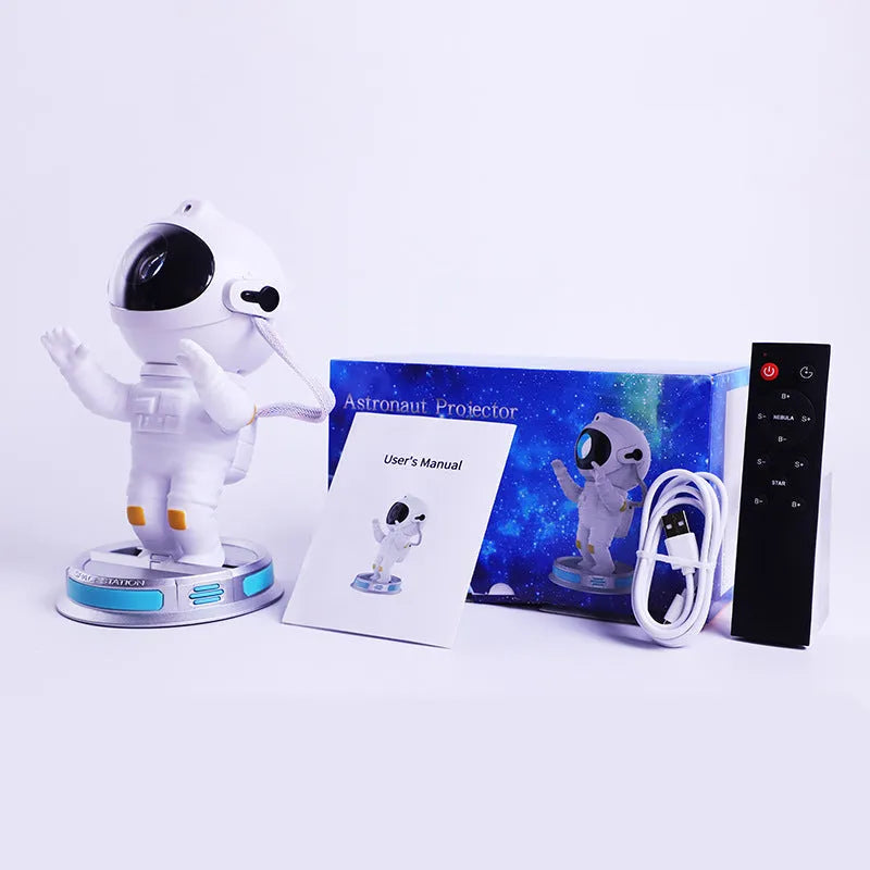 Exit Astronaut Starlight Projection Lamp in white with USB cable and remote control on a table