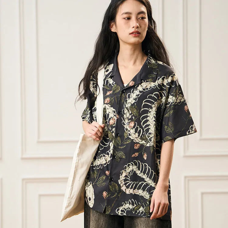 Short sleeve Cuban collar shirt with a snake bone pattern print in a loose fit.