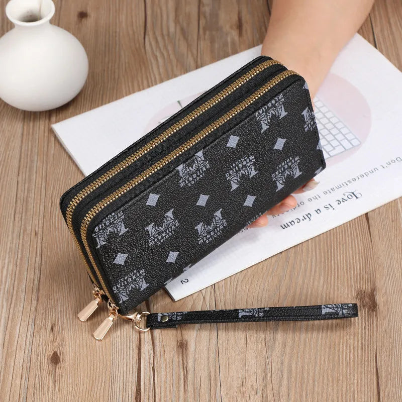 Long black PU leather wallet clutch with print detail showing mobile phone compartment and coin purse
