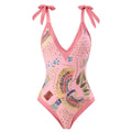 French retro blue one-piece swimsuit with gauze skirt on beach