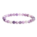 Purple handmade natural stone bead bracelet with geometric shape and elastic cord.