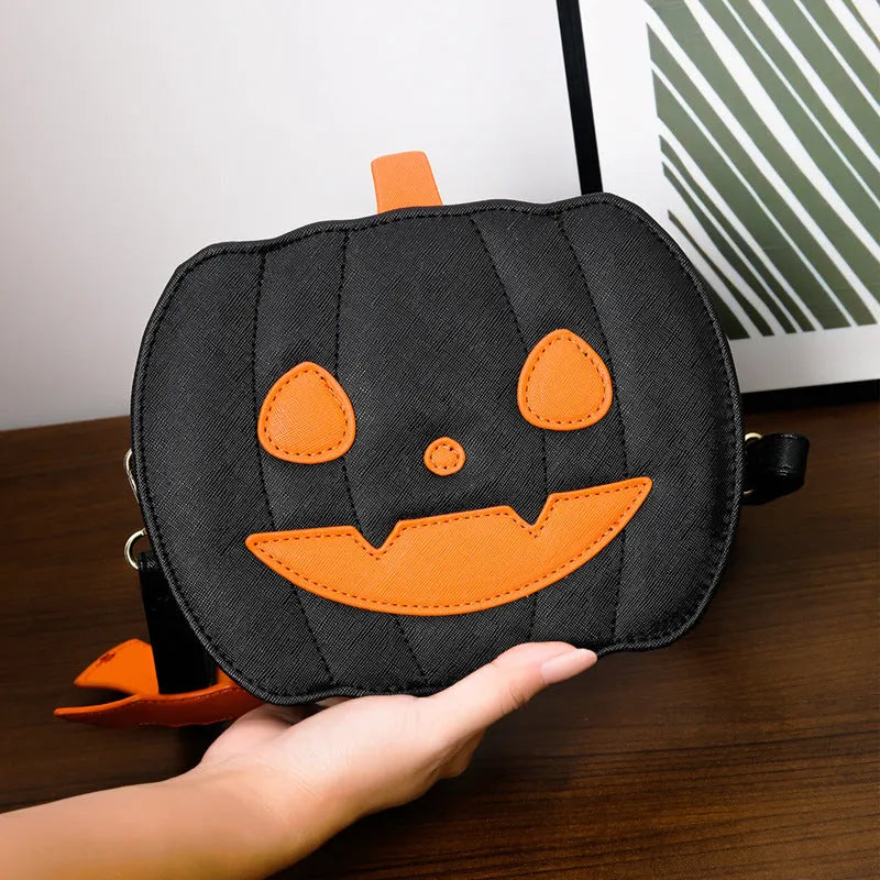 Horizontal view of a PU crossbody bag with pumpkin and bat cartoon design in orange colour option.