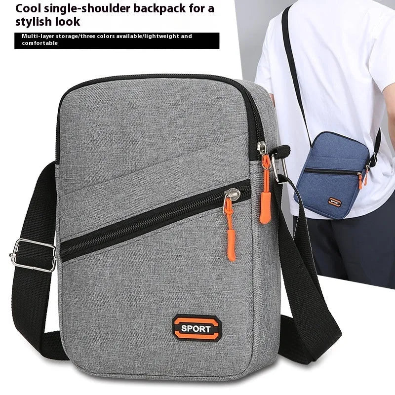 Lightweight solid colour Oxford cloth crossbody commuter bag with contrast detailing