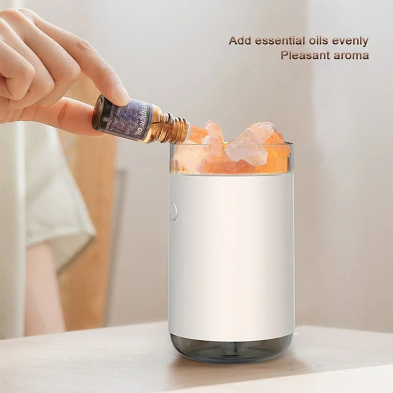 Ultrasonic humidifier diffuser with crystal salt stone and LED lamp in white finish on a desk with USB cable
