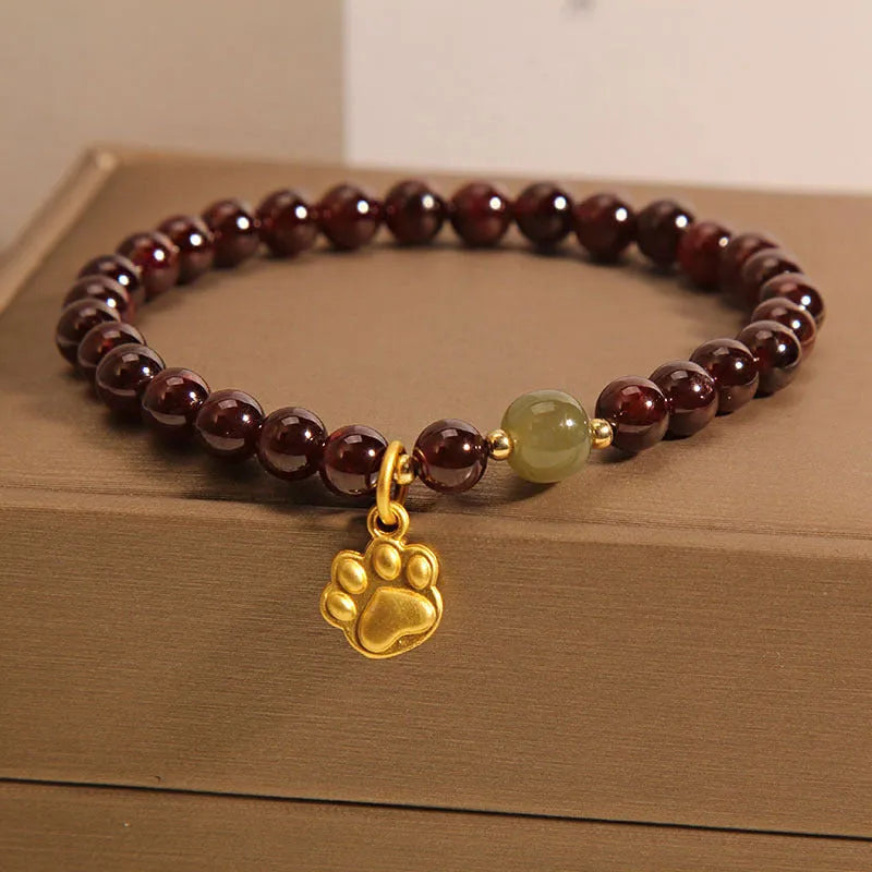 Women's adjustable crystal bracelet with Cat's Paw garnet colouration and original design