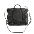 Black handmade vegetable tanned cowhide tote bag with zipper closure and 15-inch computer slot for daily outdoor use