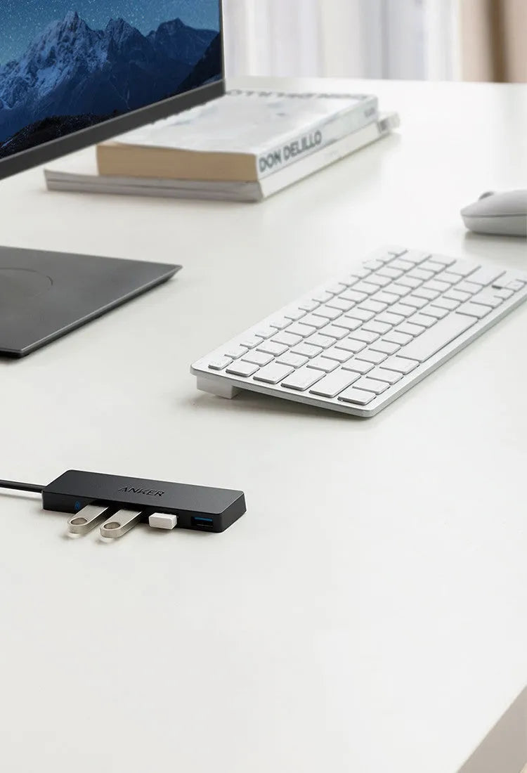 Black Anker 4-port USB 3.0 hub with 20cm cable showing compact 30x107mm dimensions