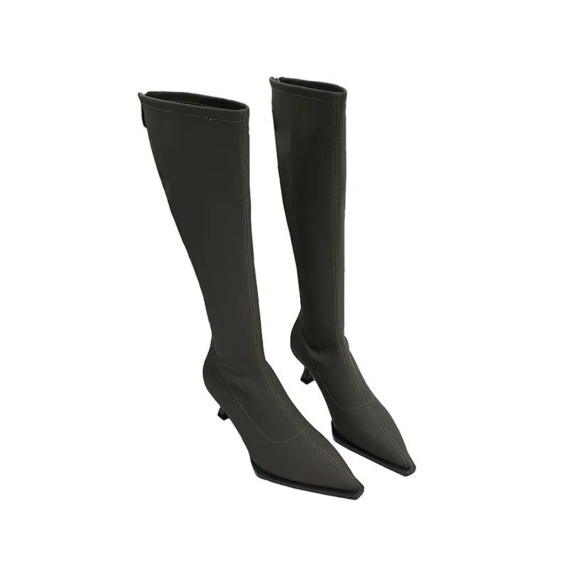 Black women's ankle boots with a pointed toe, stiletto heel, and a back zip fastening.
