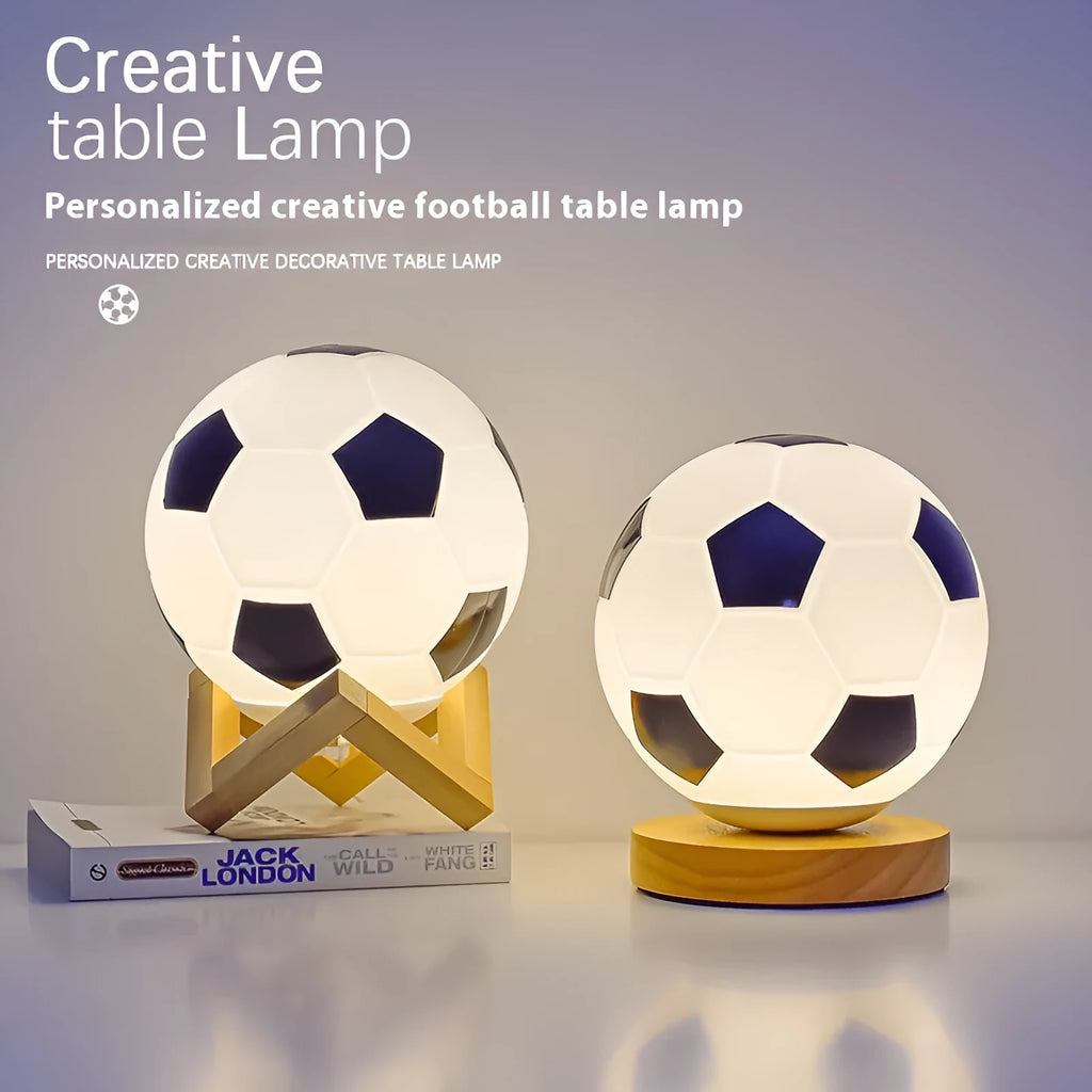 Football LED small night lamp with glass shade and remote control on a bedside table