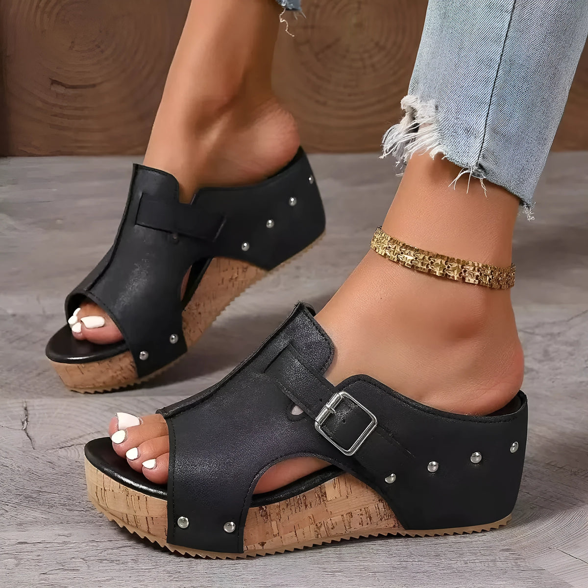 Plus size wedge sandals with rivet detailing, fish mouth open toe, PU upper, and rubber sole in black colour option.