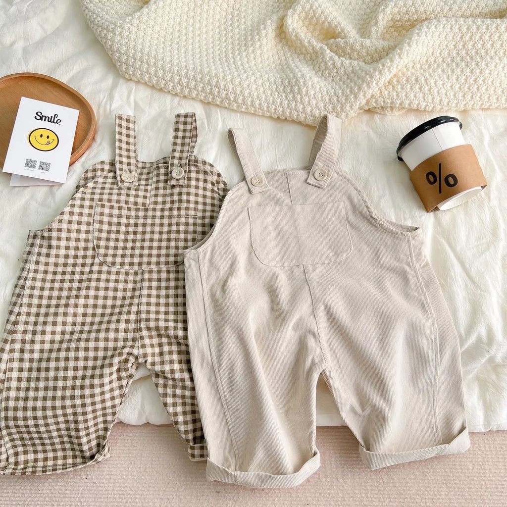 Infant plaid corduroy overalls in creamy-white with large pockets and double breasted closure