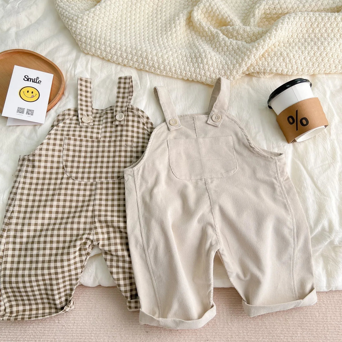 Infant plaid corduroy overalls in creamy-white with large pockets and double breasted closure