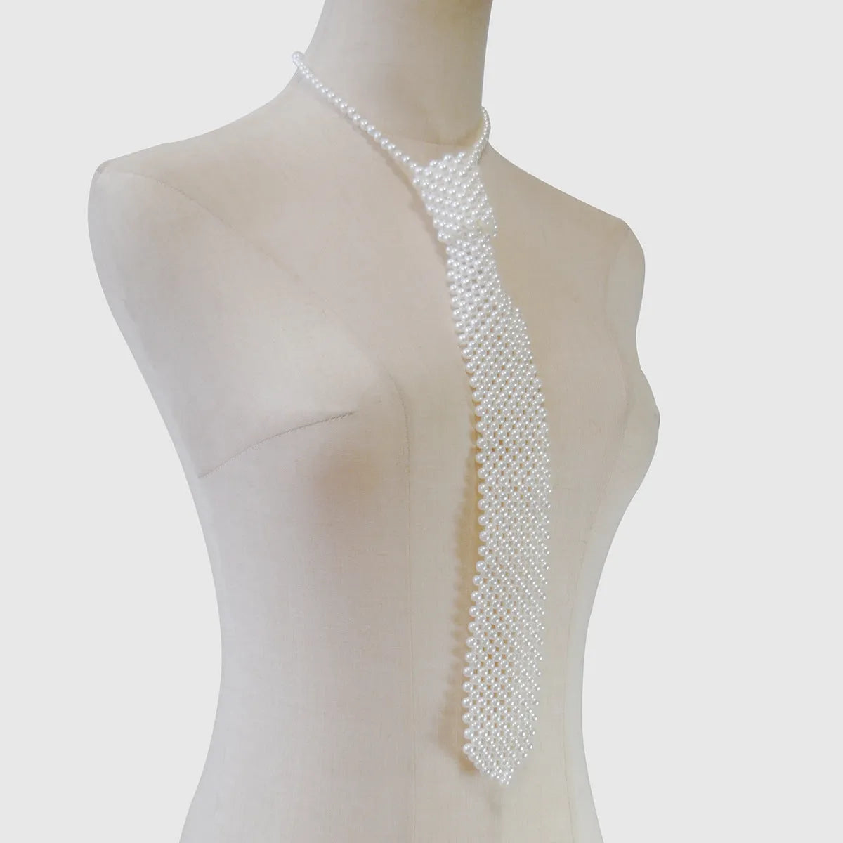 Pearl body chains with adjustable tie closure and hollow out chain design in black colour