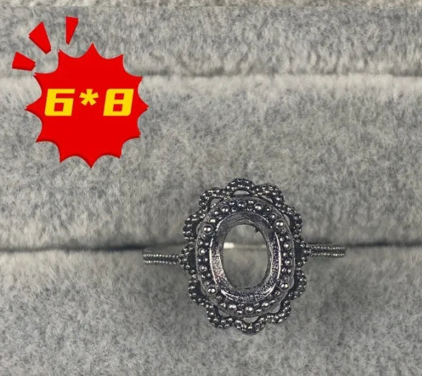 Oval denier ring with open mouth design showing 6*8mm main stone and five-pointed star decoration