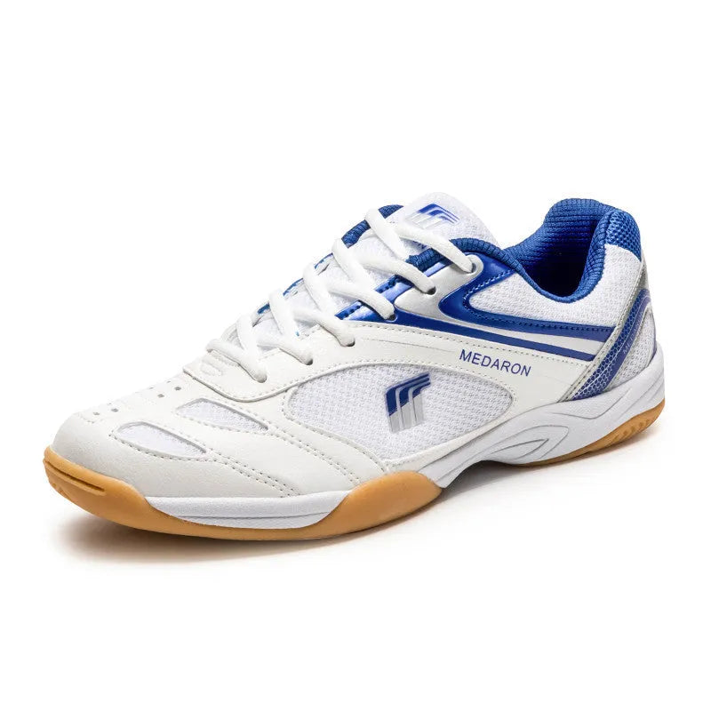 White and red mesh table tennis sneakers with rubber sole and lace-up front.