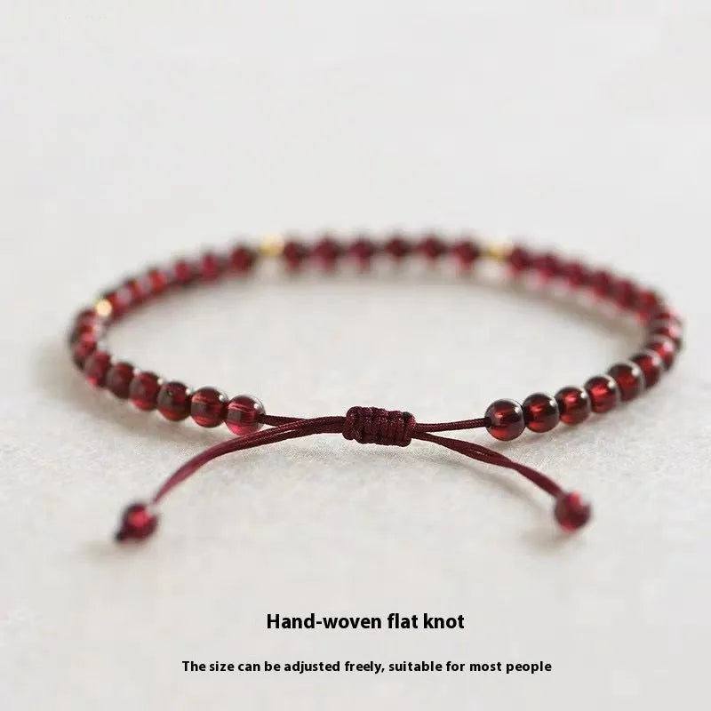 Hand-woven Chinese garnet bracelet with red rope and flexible wire