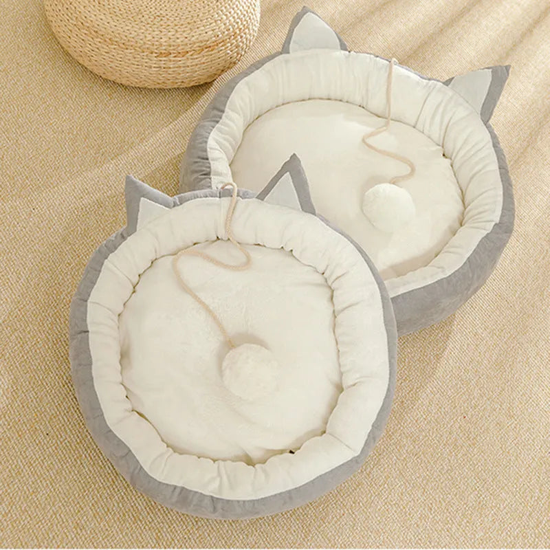 Round suede cat mat in pink grey with cat ear shape, 36cm diameter, on a light floor