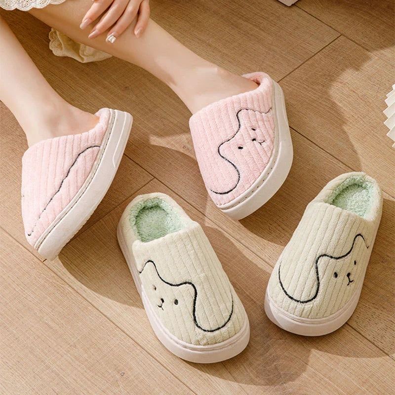 Cozy cat-themed slippers with plush uppers and non-slip rubber soles, available in a variety of vibrant colors