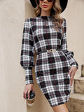 Black women's tight dress with lantern sleeves and leather stitching detail on the front.