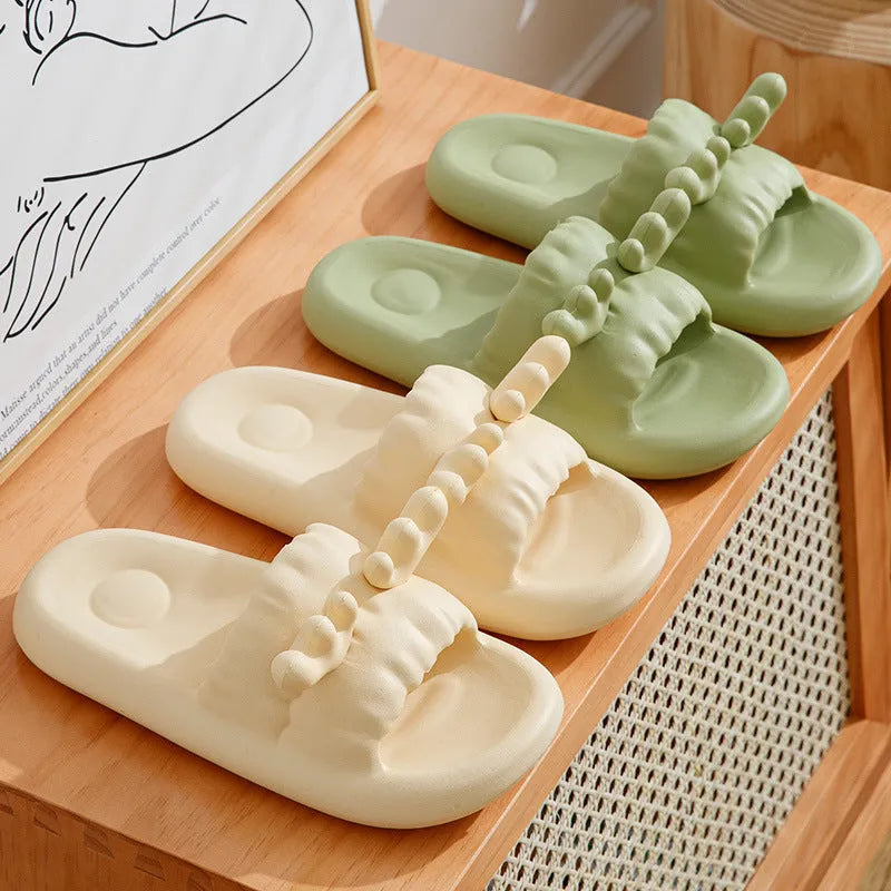 Women's flip-flop style slippers with deer horn design, shown in light yellow on a non-slip EVA sole.