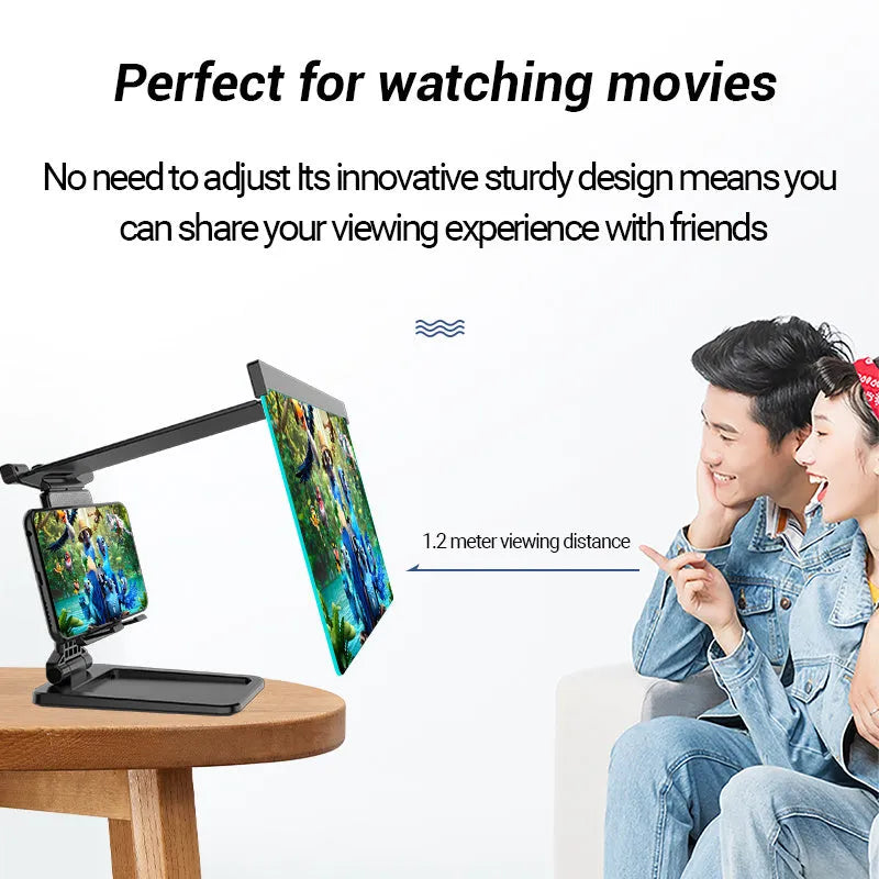 Black folding mobile phone screen magnifier and detachable holder on a desktop.