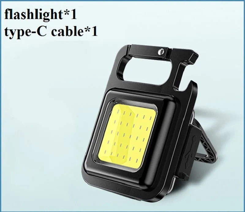 Mini rechargeable COB keychain flashlight with 400 lumens, USB cable, and hook for hands-free use as work light