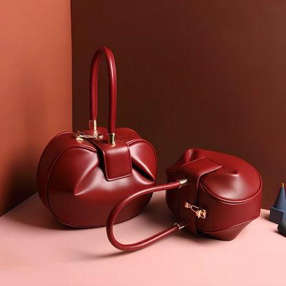 Women's cowhide leather tote bag in tramp shape with single handle and buckle, available in apricot, black, and other colours, big size 35cm x 40cm