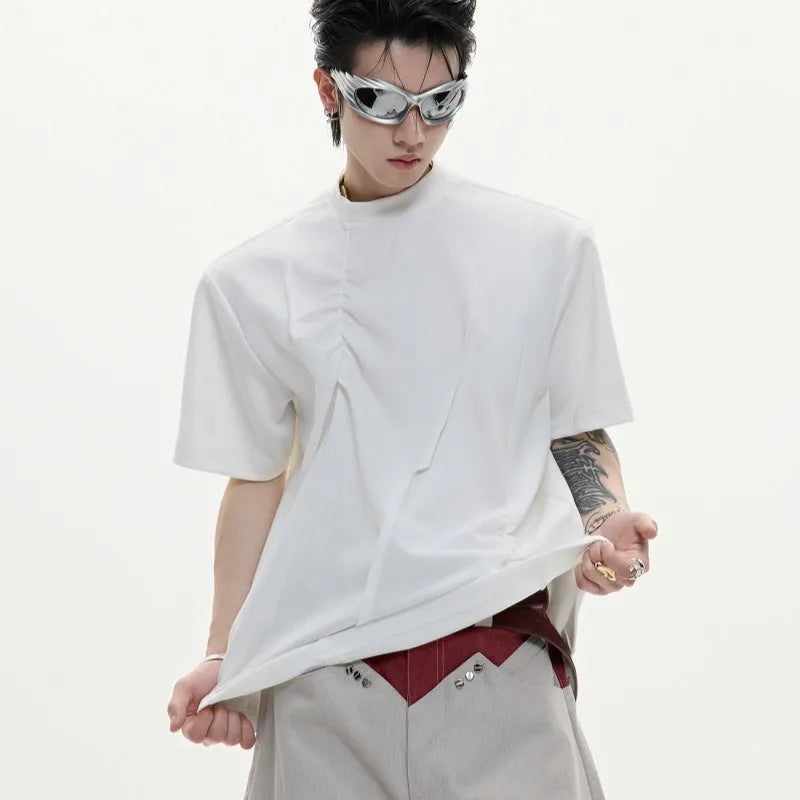 Men's grey loose fit cotton t-shirt with three-dimensional pleated texture detail on front.