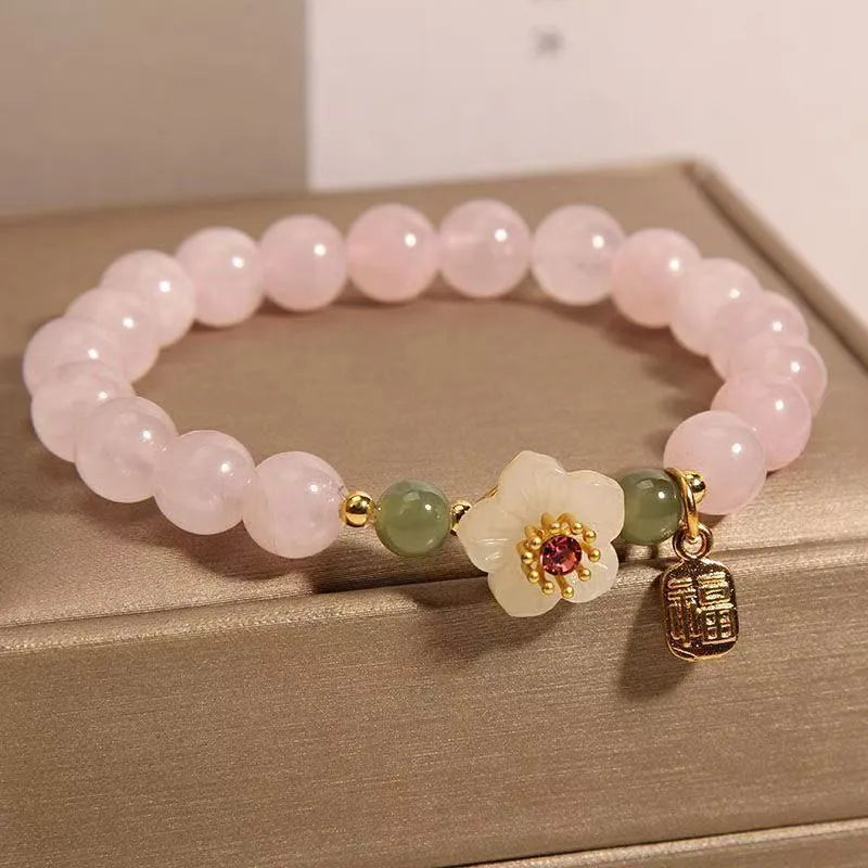 Crystal Hetian Jade bracelet with camellia fruit-shaped charms in pastoral style design