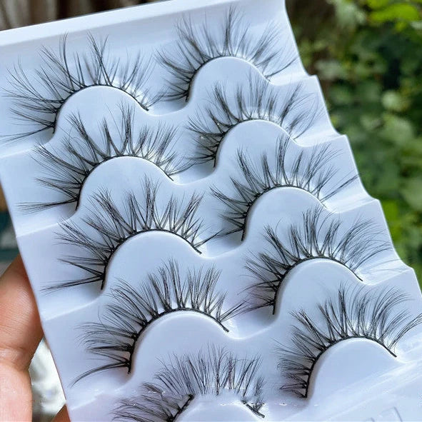 Curled messy cross sparse mixed blood super fairy lashes in black with 13mm length, providing natural volume enhancement with five reusable pairs per box including adhesive