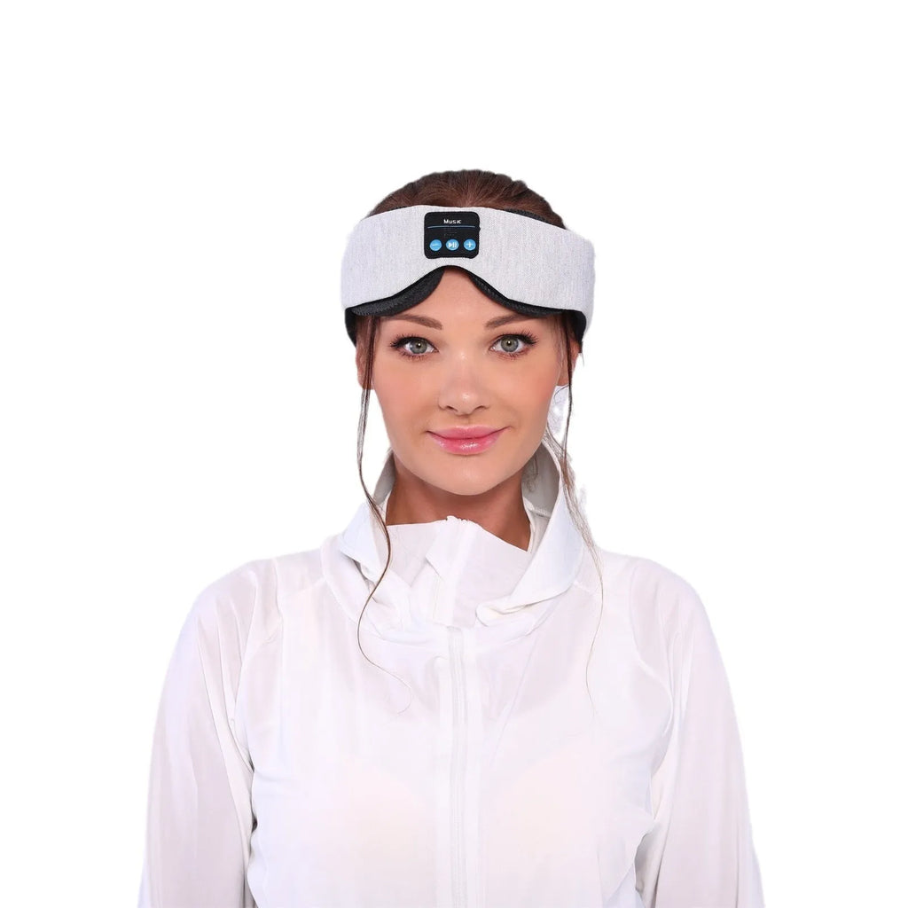 Grey contour Bluetooth sleeping eye mask with built-in speakers for wireless music playback.