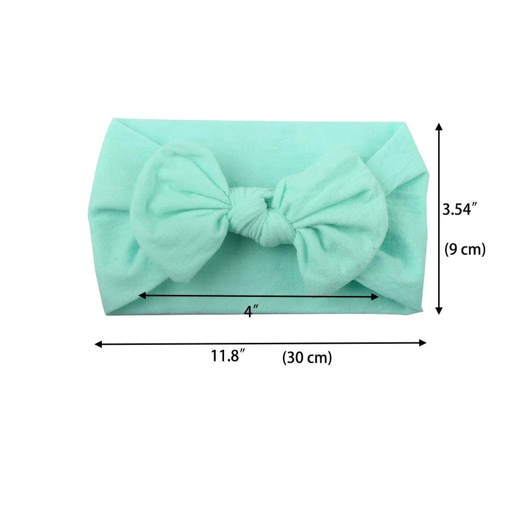 Super stretchy soft knot headband with bow for baby girls in 22 colours, made from nylon and spandex