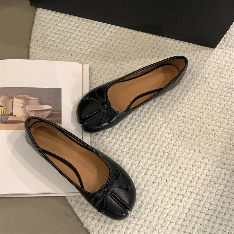 Women's split-toe flats in beige colour showing round toe design and slip-on style with shallow vamp cut