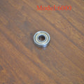 6000zz carbon steel miniature ball bearing showing 10mm inner diameter and 26mm outer diameter.