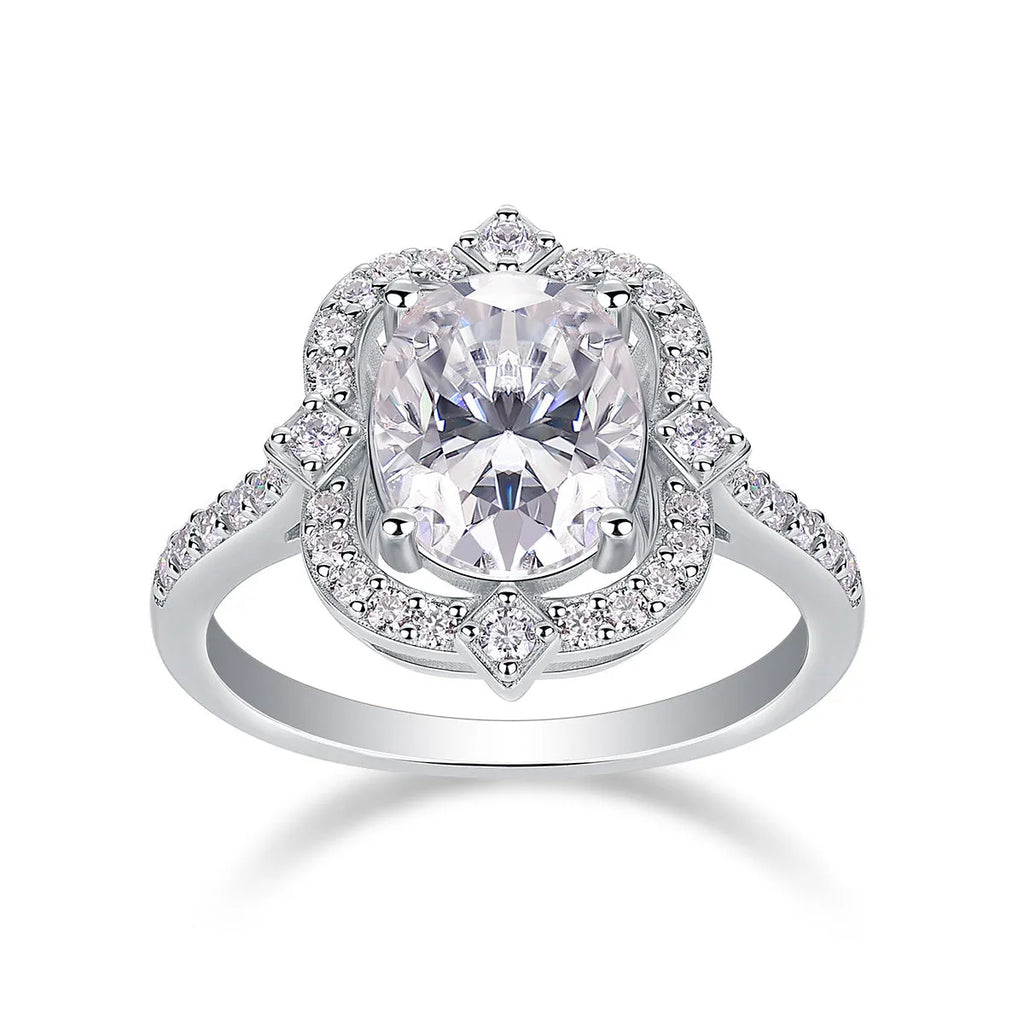 Egg-shaped moissanite ring set with S925 silver and platinum plating on a white surface