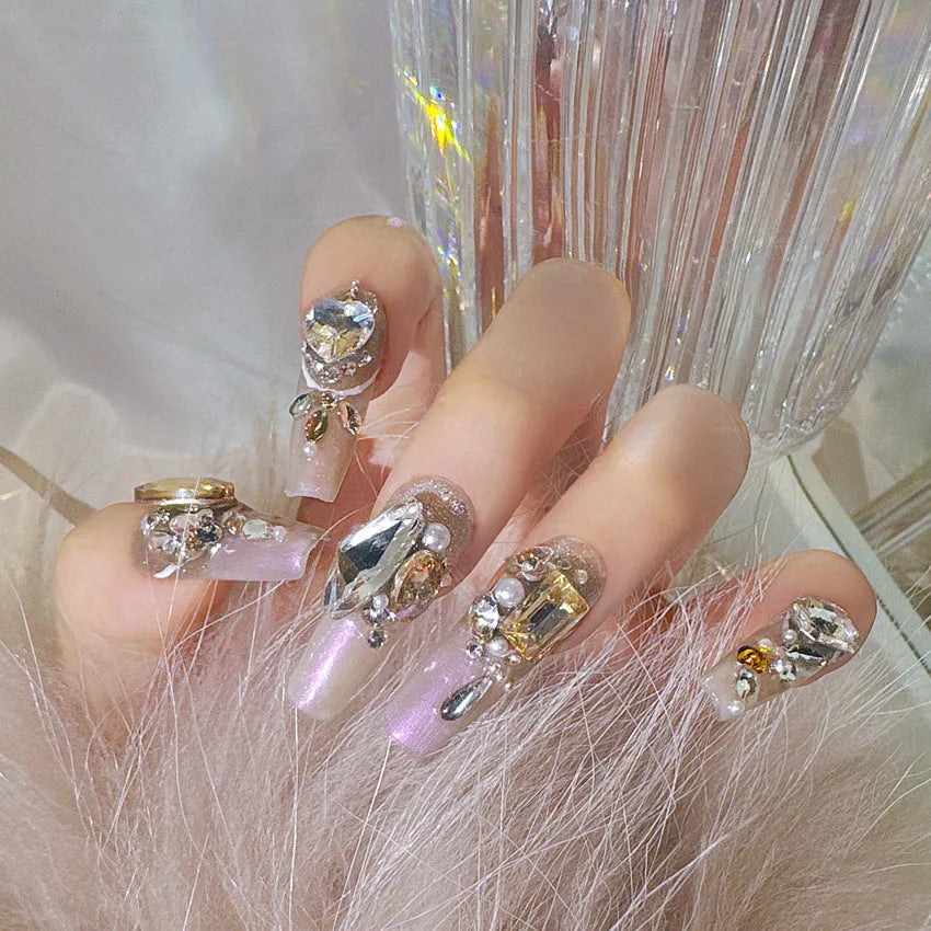 False nail patches with luxury rhinestone designs and phototherapy sealing layer on card packaging