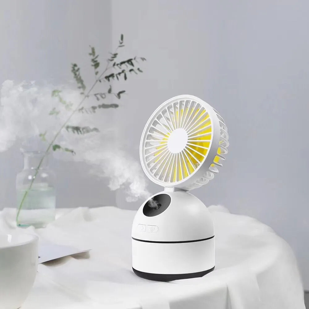 Portable USB fan humidifier in white with cool mist output and integrated fan, placed on a desk