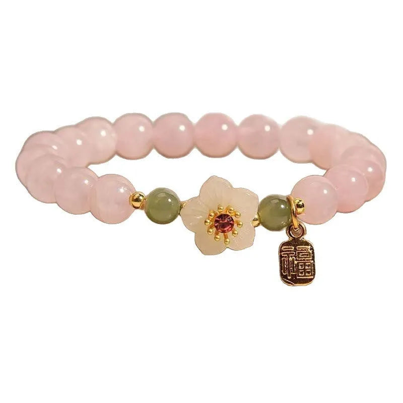 Crystal Hetian Jade bracelet with camellia fruit-shaped charms in pastoral style design