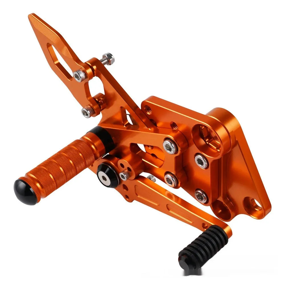 KTM DUKE motorcycle raised footrest relocation kit in black and orange colours