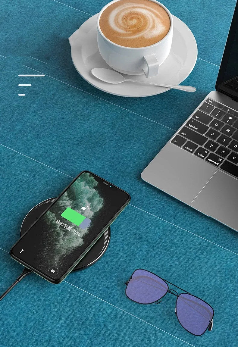 Black Kuulaa wireless disc phone charger with Micro USB port and LED indicator light