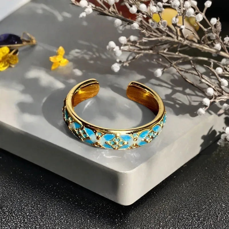 Adjustable copper ring with a vintage gourd, flower, and bow design in a new Chinese style.