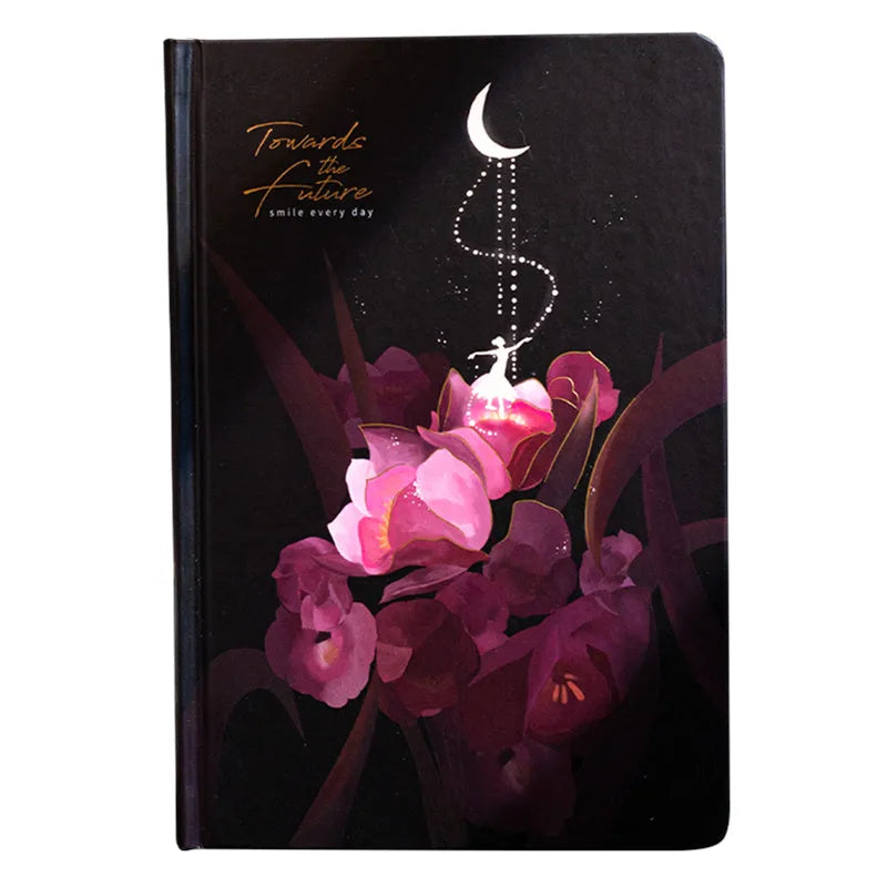 A5 notebook with luminous cover open to show colour illustration inside, in deep blue colour option.