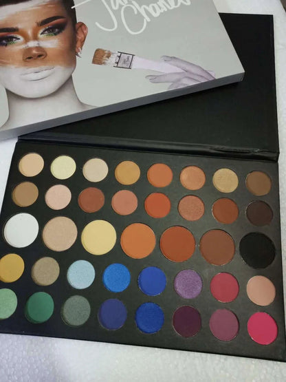 39-colour earth tone eyeshadow palette showing pearlescent and matte finishes in compact with mirror