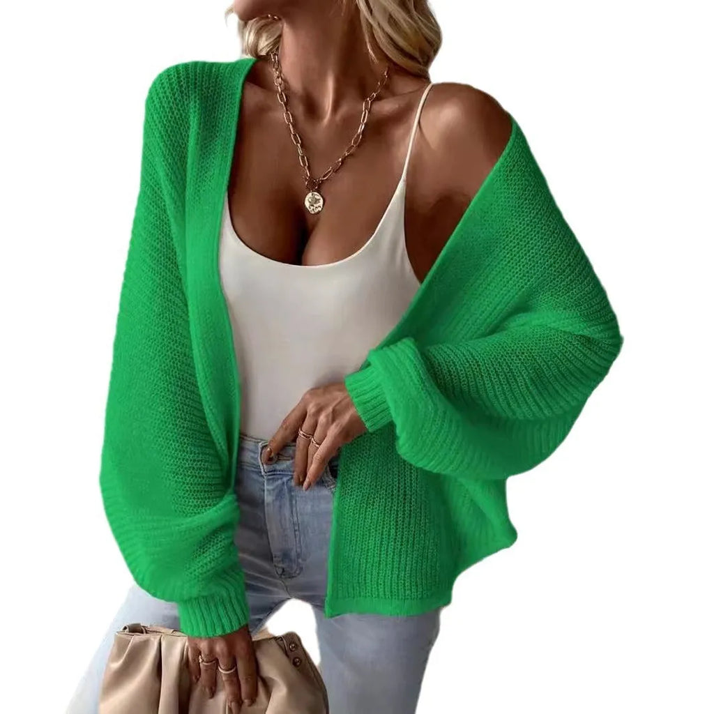 Women's loose-fit batwing sleeve cardigan in solid colour, made from thin polyester fabric.