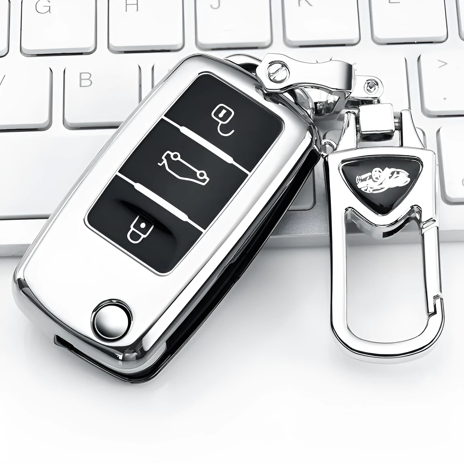 VW Model A folding key case in blue, holding three keys with a visible buckle closure.