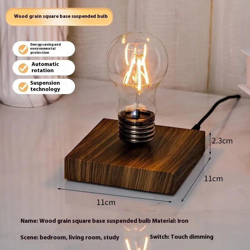 Modern suspension bulb desk night lamp with iron art construction and black wood grain base.